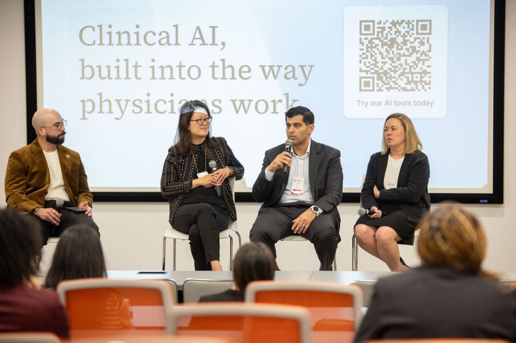 Panelists on stage during the Clinical AI panel at the National Medical Fellowships 80th Anniversary